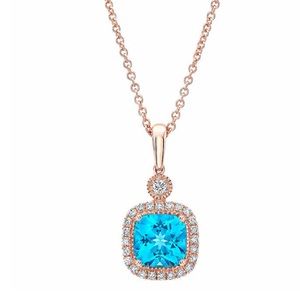 Costco Blue Topaz and Diamond 14kt Rose Pendant